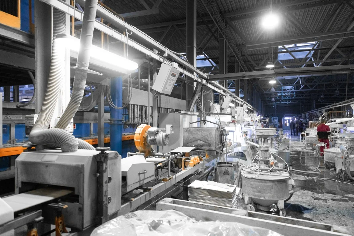 Workers perform their tasks in the shop production plant