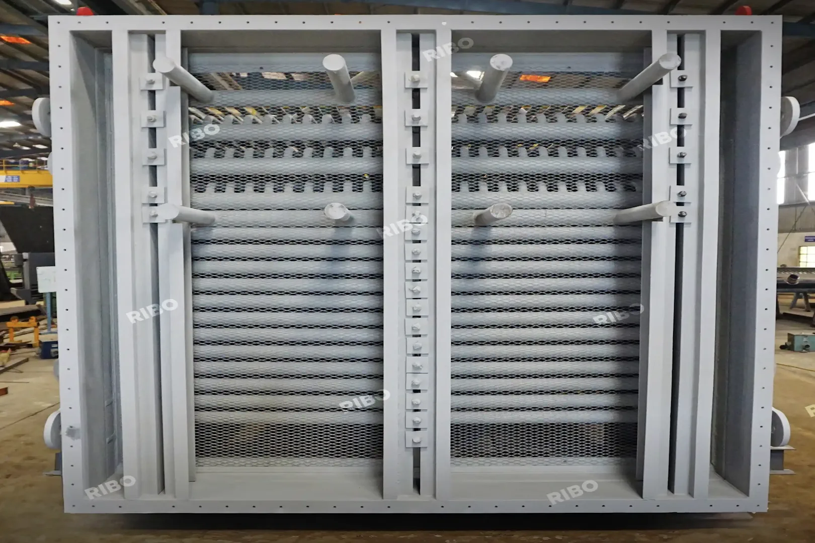 Front-facing superheater module with protective mesh and airflow control louvers