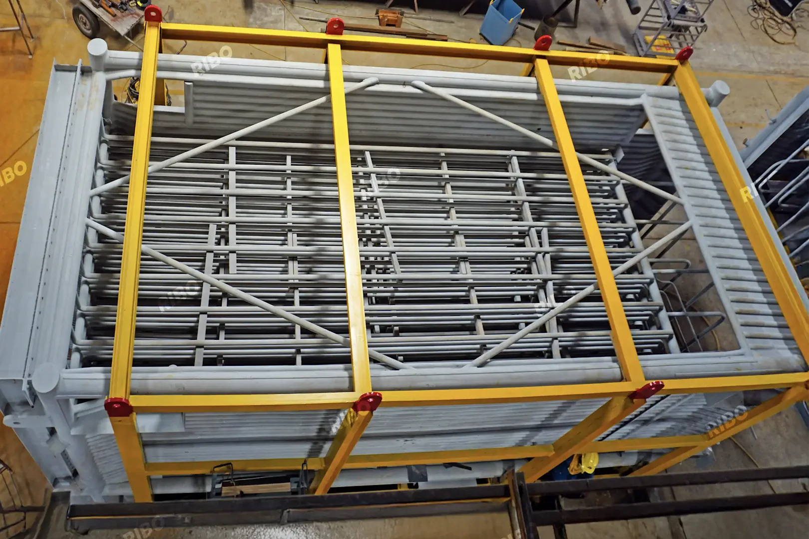 Top view of superheater module with parallel finned tubes in structural casing